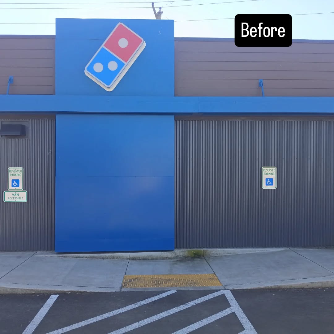 Commercial storefront building exterior before pressure washing