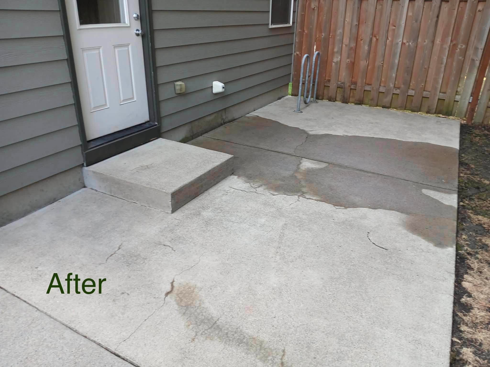 Residential concrete patio cleaned after pressure washing